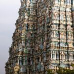 Detailed view of the ornate Meenakshi Amman Temple towers in Madurai, India showcasing stunning architecture.
